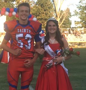 DeKalb West School Saints Homecoming 8th grade attendant Zoi Layna Hale with escort Trace Hamilton