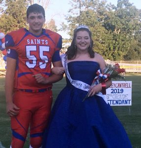 Saints Homecoming 8th grade attendant Ansley Faith Cantrell with escort Wil Farris