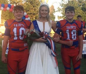 DeKalb Saints Homecoming Queen Allyson Roxanne Fuller with escorts Ari White (left) and Briz Trapp (right)