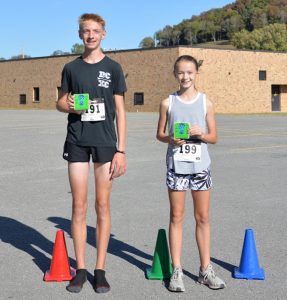 Aaron Gottlied and Madeline Martin are the Overall Male and Female race winners for the 5th Annual 3.21 5K Race for Down Syndrome Awareness. Over 100 participants, ranging in age from 9 years to 70+ years, ran or walked the course at DeKalb West School on Saturday, Oct. 5, 2019.