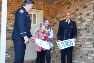 The Stephen Siller Tunnel to Towers Foundation held a home dedication ceremony for Caitlin Anderson and daughter Lilly Grace at 155 Evergreen Lane, Smithville this morning (Monday). (Picture shows Lilly Grace cutting the ribbon with Caitlin behind her). The Tunnel to Towers Gold Star Family Home Program honors the legacy of those who made the ultimate sacrifice while serving our country. The Foundation provides mortgage-free homes to surviving families with young children. Army PFC Billy Anderson lost his life in Afghanistan on May 17, 2010, leaving behind his young wife Caitlin and 8 month old daughter Lilly Grace who is now 10 years old.