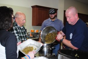 local emergency service providers prepared green beans and other delicious food on Thanksgiving for delivery to the needy in the community