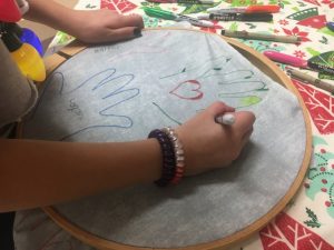 Kids decorated quilt squares which will be assembled to make a quilt to be donated to somebody who needs a blessing in the community.