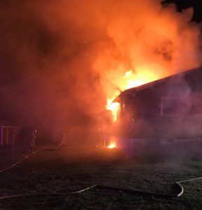 A home on Estes Street in Smithville was heavily damaged by fire Friday night. Smithville Fire Chief Charlie Parker said Brad Driver lived there but he was not home at the time of the fire. (Tim Holmes Photo)