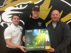 On Friday DCHS Basketball Coaches John Sanders (left) and Danny Fish (right) thanked Matt Quarles, President of the DeKalb Junior Pro basketball League, for donating funds to purchase new wireless microphones to be used as part of the gym’s public address system.