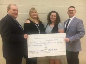 DeKalb Middle School 7th grade math and science teacher Teresa Jones (second from right) is the DeKalb County Teacher of the Year. She received the “John Isabell Memorial Award” for the honor in March along with a school bell and a check for $150 from Liberty State Bank presented by Roy N. Pugh of Liberty State Bank Pictured left to right: Roy N. Pugh, Lori Isabell, Teresa Jones, and Director of Schools Patrick Cripps