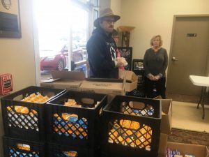 Smithville First Baptist Church Pastor Chad Ramsey prepares to offer blessing before food distribution to students Monday