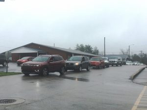 Automobiles began lining up more than 2 hours ahead of time this morning (Monday) at the Smithville First Baptist Church Life Enrichment Center on the first day of a drive through food distribution for kids out of school due to the COVID-19 threat. Another distribution was held simultaneously at DeKalb West School.