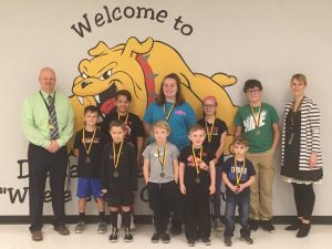 DeKalb West School Announces March Students of the Month. Pictured first row left to right are Sawyer Hendrix, Ashetan Ahlgard, Asher Desimone, and Jack Harvey. Second row left to right are Assistant Principal Joey Agee, Levi Cripps, Adin Hernandez, Alexis Haugh, Charlotte Cripps, Johnathan Keith, and Principal Sabrina Farler. Not pictured Alyssa Crook.