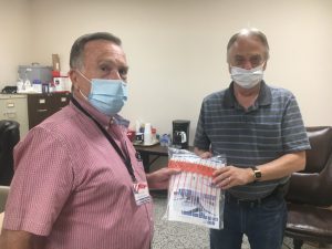 Election worker Billy Willingham (left) and Administrator of Elections Dennis Stanley (right) prepare for a busy day of Early Voting Friday