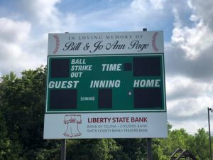 The DeKalb County Church League Softball season begins next week and the first run will light up on a new score board that is “In Loving Memory of Bill and Jo Ann Page,” who founded the field and ran it. Before Ms. Page passed away last year, she had secured funding from Liberty State Bank for the score board. Darrell Gill with Gill Automotive used his company’s equipment recently to mount the sign while Smithville Electric positioned the posts.