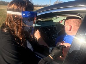 The DeKalb County Health Department received its first shipment of the Moderna COVID-19 vaccine Monday and began administering it to local first responders and health care providers. Photo shows DeKalb Health Department LPN Ronda Johnson, administering the vaccine to county firefighter Matt Boss