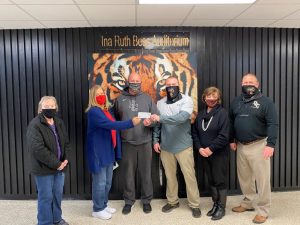 DeKalb Retired Teachers make memorial tribute donations to two DCHS athletic programs. Pictured from left are Linda Thweatt, Becky Davis, Coach Danny Fish, Coach Tad Webb, Donna Davis, and DCHS Principal Randy Jennings