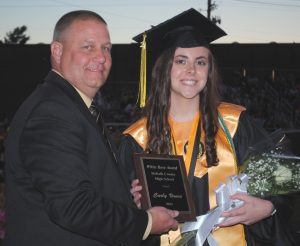 DCHS Principal Randy Jennings presents White Rose Award to Carly Vance during Class of 2021 graduation Friday night, May 14. Vance was also the Valedictorian and Class President