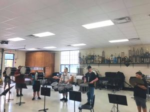 Percussion players begin practice for the new marching season.