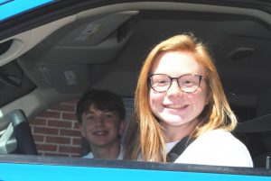 Emma Johnson and Ryder Miller took second place in a blue 4 wheel drive Dodge Ram pickup truck