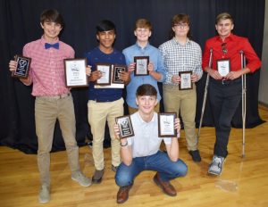 The stars of the DeKalb Saints Football and Cheerleading programs came out Monday night for the annual awards banquet held at the First Baptist Church Life Enrichment Center. Pictured from left are Most Valuable Player Jon Hendrix, Offensive Player of the Year Juan Ortega, Most Improved Turner Bryant, Lineman award winner Bryson Arnold, "Saints" award winner Aiden Turner, and Defensive Player of the Year Wyatt Carter (kneeling). (Chris Tramel Photo)