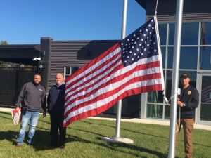 Woodmen Life representative Tim Bumbalough supplied the Smithville Police Department Friday with new United States and Tennessee State flags to fly outside and for display inside the building.