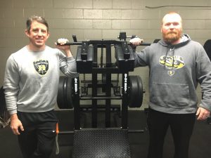 DCHS Tiger Basketball Coach John Sanders (left) and Tiger Baseball Coach Tad Webb (right) show off some of the new weight room equipment for their athletic programs thanks to the support of Wilson Bank & Trust