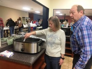 It all starts in the kitchen! Darlene and Calvin Ray Tramel were among many volunteers who helped prepare Thanksgiving Day meals for the needy and underserved on behalf of the DeKalb Emergency Services Association.