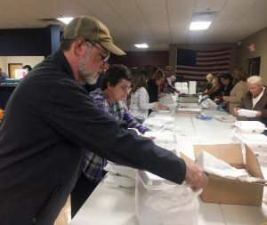 Bagging the food trays! Volunteers began bagging filled food trays Thanksgiving Day morning in preparation for delivery to the needy and underserved on behalf of the DeKalb Emergency Services Association.