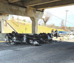 The College Street Bridge has been hit again! Trooper Bobby Johnson of the Tennessee Highway Patrol said 48 year old Timmy Ford of Crossville was traveling east on Broad Street Wednesday in a 2014 Peterbilt pulling a trailer loaded with crushed vehicles and scrap metal when part of the load struck the bottom of the bridge as the truck and trailer passed under the overpass. Ford was not in injured but was cited for his load being over height limits. The bridge has been struck several times in recent years. (Jim Beshearse photo)