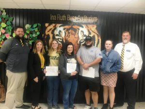 DeKalb County High School continued its monthly observance Monday of recognizing a teacher, student, and parent or guardian of the month: Pictured here left to right are Assistant DCHS Principals Thomas Cagle and Jenny Norris, Student of the Month Jacklyn Kleparek, Teacher of the Month Amy Cantrell, Parent of the Month Michael Coronado and his foster daughter Essay winner Skylar Callahan Swain, and DCHS Principal Bruce Curtis.