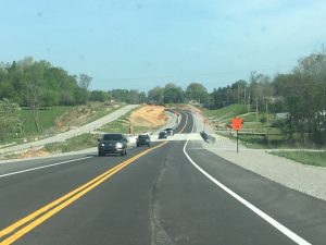 Picture shows traffic diverted from old to new road alignment on Highway 56 near Sink Creek