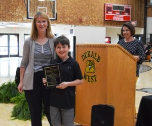 Karson Mullinax poses with Principal Sabrina Farler in recognition of his Perfect Attendance Award.