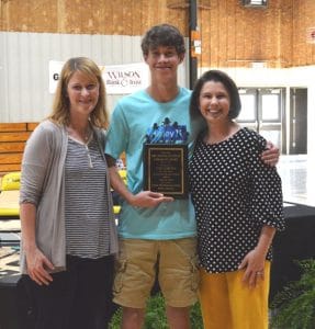 For the second year in a row Ethan Brown received the Mrs. Amanda Mullinax Librarian’s Award for the most accummulated Accelerated Reader points. He has notched 1986.9 points.Pictured left to right are Principal Sabrina Farler, Ethan Brown and Librarian Amanda Mullinax.