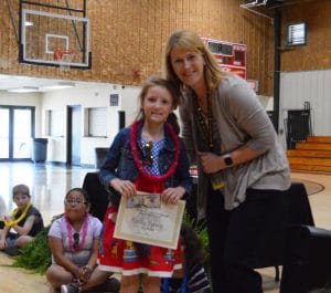 First grade student Marley Pyburn stands by DWS Principal Sabrina Farler with the Perfect Attendance Award for the 2021-22 school year.