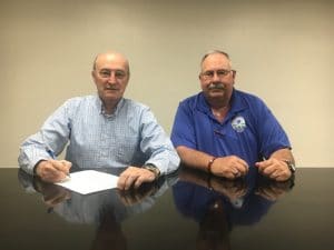 County Mayor Tim Stribling signs proclamation designating May 15-21 as EMS Week in DeKalb County. Stribling is joined by DeKalb EMS Director Hoyte Hale