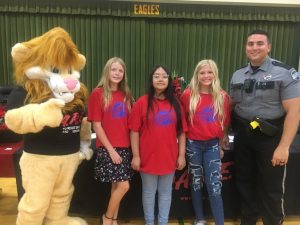 Northside Elementary School Fifth Grade D.A.R.E. Essay winners: Pictured left to right- D.A.R.E. Mascot DAREN the Lion, Emily Johnson (3rd place), Edith Granados (Overall Winner), Ella Kirksey (2nd place), and D.A.R.E. Officer Instructor Joseph Carroll