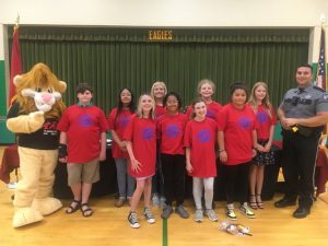 Northside Elementary School Fifth Grade D.A.R.E. Essay Class winners: Pictured left to right- D.A.R.E. Mascot DAREN the Lion, Payne Bryant, Edith Granados, Reagan Williams, Ella Kirksey, Zuly Bentran, Eden Spurgeon, Nora Dykes, Jaela Roberson, Emily Johnson, and D.A.R.E. Officer Instructor Joseph Carroll. (Not pictured- Denali Sifuentes)