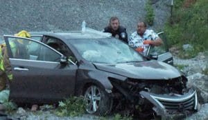 A woman and child were injured Sunday night after their car plunged off an embankment on Highway 70 near the Alexandria Livestock Sale Barn. (Chris Tramel photo)