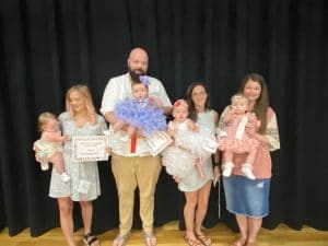 Winners in the girls 7-12 months group: Queen Emaline Joanne Wagner(second from right), 10 month old daughter of Cody and Maddie Wagner of Smithville. Second place went to Parker Mae Griffith (second from left), 10 month old daughter of Leland and Jessica Griffith of Sparta. She also received an award for Prettiest Eyes, Attire and for Most Photogenic. Sydney Ann Barrett (far right) received third place. She is the 8 month old daughter of Stephen and Vickey Barrett of Dowelltown. Enslee Shyann Knowles (far left), 7 month old daughter of Gabriel and Kylee Knowles of Smithville was awarded for Prettiest Hair.