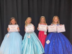 Miss Jamboree in the 4-6 year old category: Queen Kendyl Reign Atnip (far left), the 6 year old daughter of Brooke Hutchings and Cody and Kimberly Atnip of Liberty. She was also awarded for Most Photogenic. Haddeign Grace Harvey (second from left), 5 year old daughter of Chad and Kayla Harvey of Alexandria received second place and was awarded for Prettiest Hair. Erin Marie Hendrixson (second from right) 6-year-old daughter of Christy Hendrixson and Matt Hendrixson of Smithville was awarded for Prettiest Eyes. Summer Elizabeth Longmire (far right), 5 year old daughter of Drew and Kristy Longmire of Smithville took third place, the People’s Choice Award, and was judged to have the Prettiest Attire.