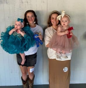 DeKalb Fair Baby Show Girls (10-12 months) Winner: Emaline Joanne Wagner (left), 11 month old daughter of Cody and Maddie Wagner of Smithville; Runner-up: Elsie Pearl Paschal (right), 10 month old daughter of Justin and Makagan Paschal of Alexandria