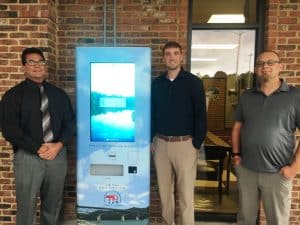 County Clerk James L. (Jimmy) Poss shows off new Outdoor Vehicle Registration Renewal Kiosk with David Casaday (BIS Sales Representative), and Jacob Rosin (BIS Field Tech) of Business Information System