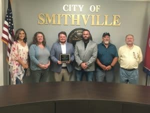 Smithville Mayor Josh Miller presented a plaque to Alderman Brandon Cox whose term expires August 31. He chose not to seek re-election as alderman. Cox was elected in 2018 and is finishing his one and only term. Pictured left to right are Alderman Beth Chandler, Alderman Jessica Higgins, Brandon Cox, Mayor Josh Miller, Alderman Danny Washer, and Alderman Shawn Jacobs