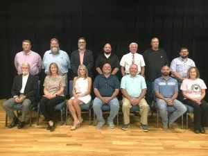 The DeKalb County Commissioners Pictured seated left to right: Tom Chandler (1st District), Sabrina Farler (2nd District), Susannah Cripps Daughtry (3rd District), Tony “Cully” Culwell (4th District), Glynn Merriman (5th District), Justin Douglas Adcock (6th District), and Beth Pafford (7th District). Standing left to right: Daniel Cripps (1st District), Myron Rhody (2nd District), Tony Luna (3rd District), Greg Matthews (4th District), Larry Green (5th District), Jeff Barnes (6th District), and Tim Reynolds (7th District)