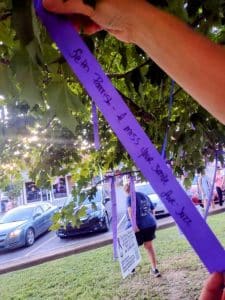 Purple ribbon messages remembering loved ones lost to overdose.