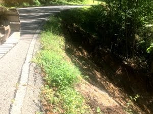 DeKalb Highway Department working to stabilize shoulder and embankment on Evins Mill Road which has badly eroded and drops off sharply to the creek below. This portion of the road is closed.