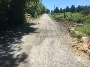 Photo shown here is the same section of Old Highway 53 near Alexandria as shown in the photo above after the repair. The road has been re-opened.