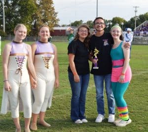 DWS Color Guard placed 1st in its division and overall in the Yellow Jacket Invitational. Pictured left to right are Olivia Diego, Eli Martin, and Hannah Swoape.