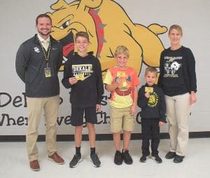 DeKalb West School students showed their colors this week for DCHS in celebration of homecoming. Thanks to Assistant Principal Thomas Cagle, DCHS organized an art contest for DWS students, and three winners were selected to be part of the homecoming game night experience. The winners were chosen among grade level groups. Pictured from left are DeKalb West School Assistant Principal Seth Willoughby, Ben Driver, Jaxson Murphy, Ty Combs, and DWS Principal Sabrina Farler.