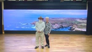 Jeff Nokes and Suzanne Williams in front of new LED video wall on stage of the Mike Foster Multi-Purpose Center County Complex