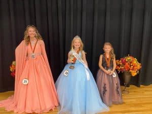 Winner of the Fall Fest Pageant (ages 7-10): Katie Jo Prichard (center) 7 year old daughter of Luke and JoDee Prichard of Alexandria. She was also awarded for prettiest smile, eyes, and attire. First runner-up Alexis Nicole Graham (left) 10 year old daughter of Derek and Andria Graham of Smithville. Second runner-up Aryanna Virginia Grace Marks (right) 7 year old daughter of Rebecca and Nicholas Marks of Smithville. She was also awarded for prettiest hair and most photogenic