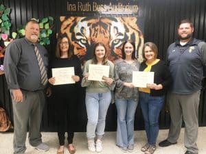 DeKalb County High School continued its monthly observance Thursday of recognizing a teacher, student, and parent of the month: Pictured here left to right are DCHS Principal Bruce Curtis, Teacher of the Month Angie Johnson, Student of the Month Bailey Mullican, Essay winner Jenna Wright with her mom and Parent of the Month Nicole Wright, and Assistant DCHS Principal Thomas Cagle.