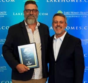 Center Hill Lake agent Tony Luna was honored with the Big Wave Award for his achievements in real estate at Lake Homes Realty’s 9th Annual National Agent Summit, held October 4 – 6, 2022. Pictured with CEO Glenn Phillips